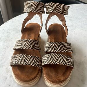 Altered state, black, and tan wedged cork shoes. Woman’s size 8